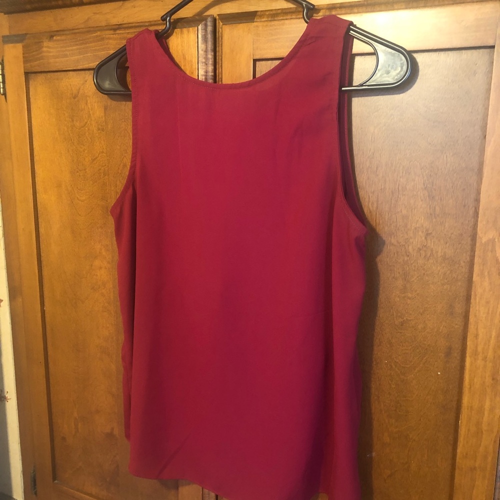 Cute burgundy red dressy tank top with bow detail and open back detail.